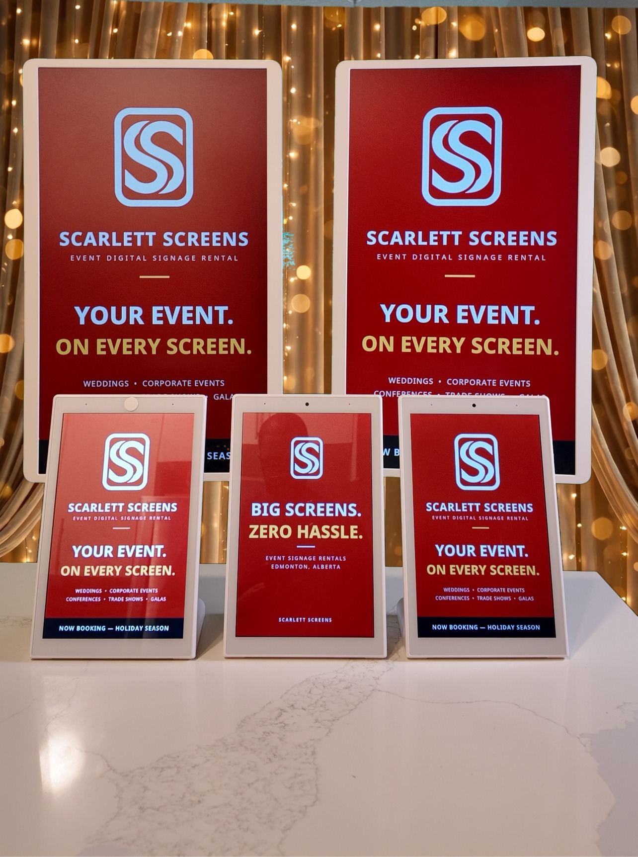All five Scarlett Screens displays set up together at a venue, showing the Scarlett Screens welcome design